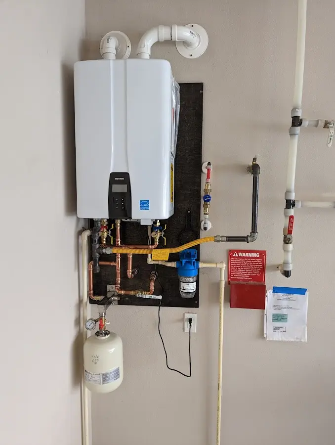 Professional plumber installing copper piping in a Rusk home